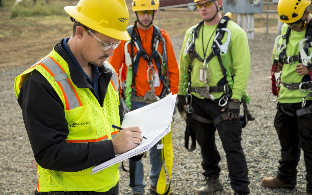 Engineers checking spec sheet