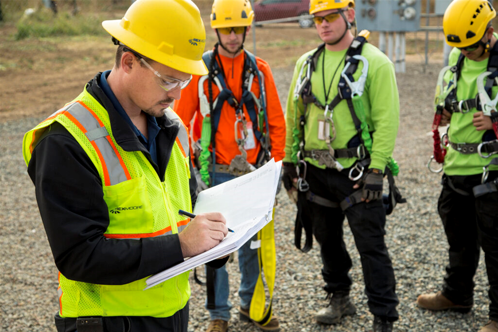 Engineers checking spec sheet